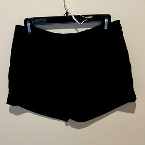 Black pleated shorts